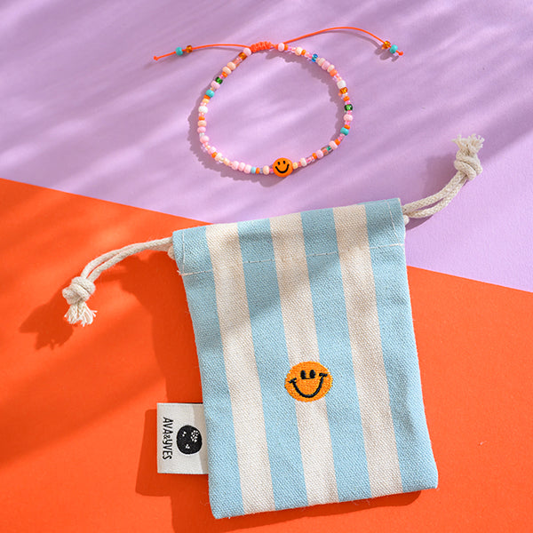 Perlenarmband orange/rosa smile mit Makrameeverschluss und Säckchen