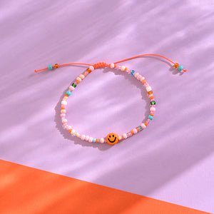 Perlenarmband orange/rosa smile mit Makrameeverschluss und Säckchen