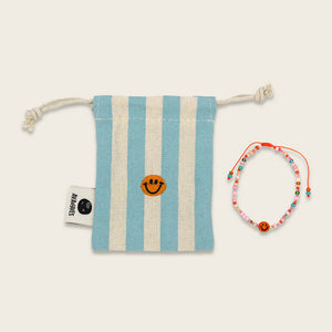 Perlenarmband orange/rosa smile mit Makrameeverschluss und Säckchen
