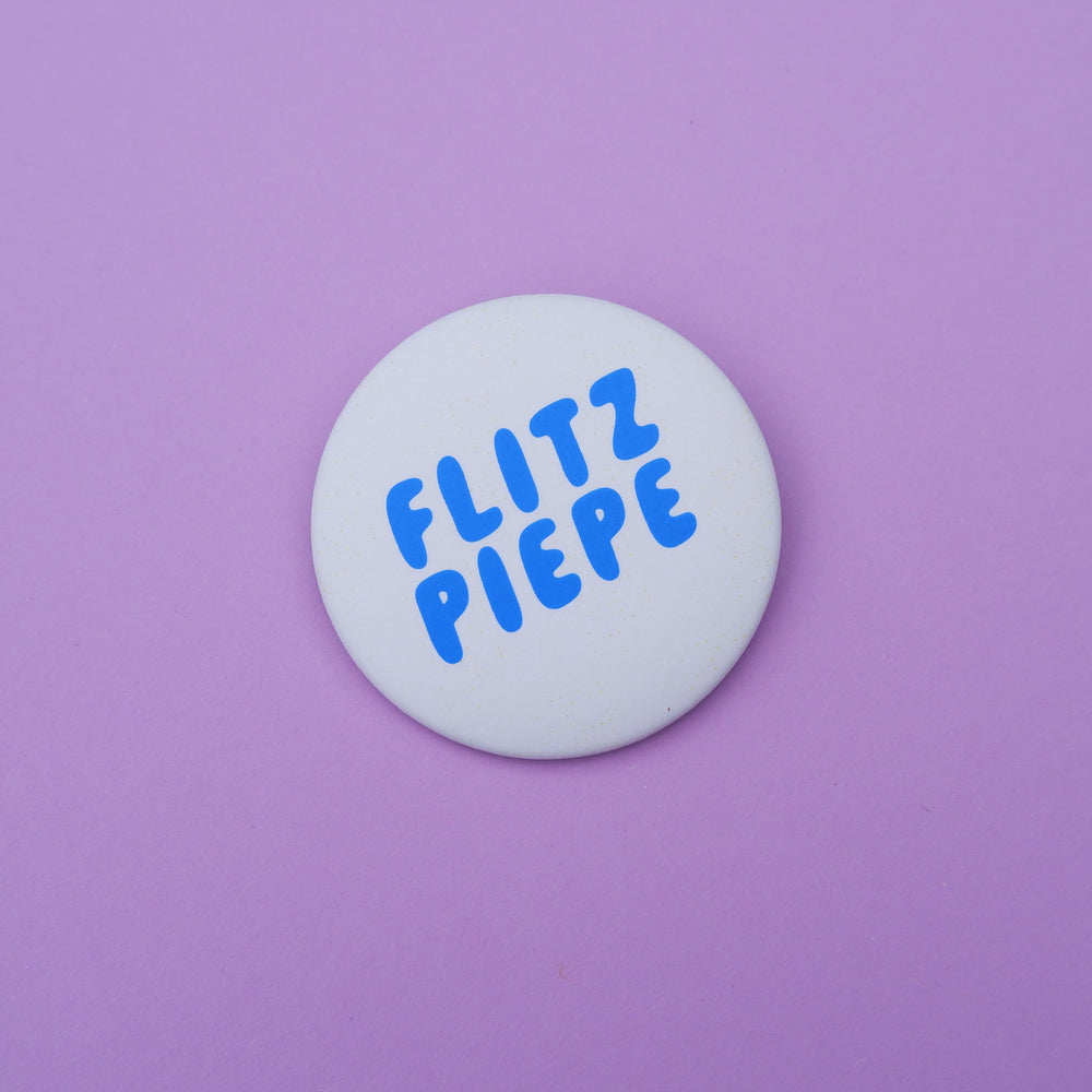 Button "Flitzpiepe" blau